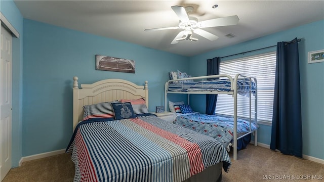 bedroom featuring carpet flooring, baseboards, a closet, and ceiling fan