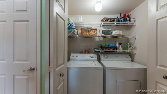 laundry area featuring laundry area and washing machine and clothes dryer