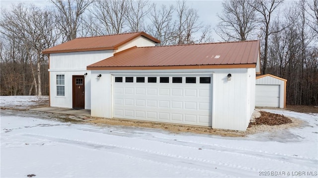 view of snow covered garage