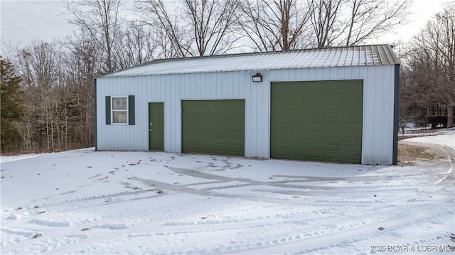 view of snow covered garage