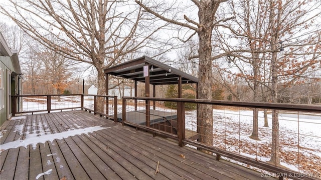 view of snow covered deck