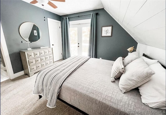 carpeted bedroom featuring access to outside, ceiling fan, and vaulted ceiling