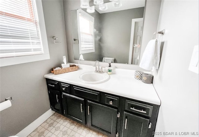 bathroom featuring vanity and toilet