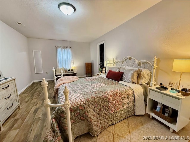 bedroom with light wood-type flooring