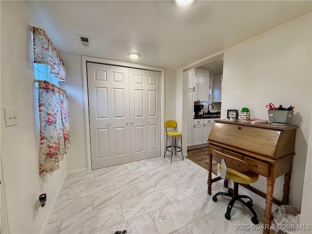 home office featuring sink