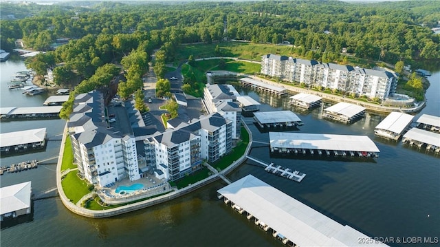 birds eye view of property with a water view