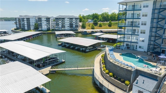 85 Monarch Cove Ct Unit 3A, Lake Ozark, MO 65049 - bird's eye view of apartment complex / building, a large body of water, and a pool area