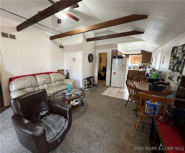 living room featuring lofted ceiling, light carpet, and ceiling fan