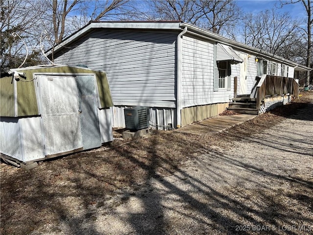 view of side of property featuring cooling unit