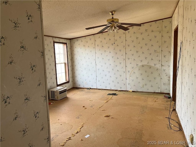 unfurnished room with ceiling fan, ornamental molding, a wall mounted AC, and a textured ceiling