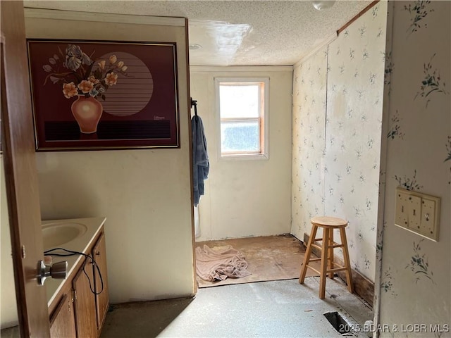 bathroom with vanity and a textured ceiling