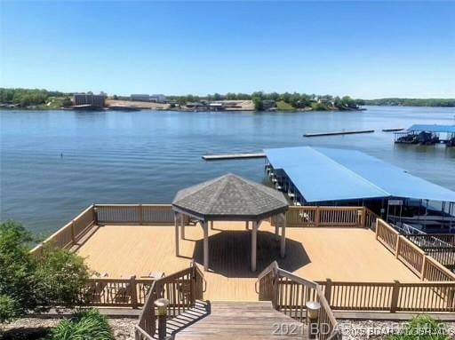 dock area featuring a gazebo and a water view