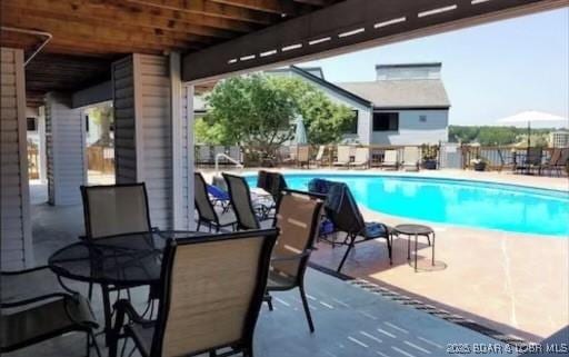 view of pool featuring a patio