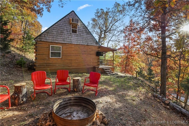 view of patio / terrace featuring an outdoor fire pit