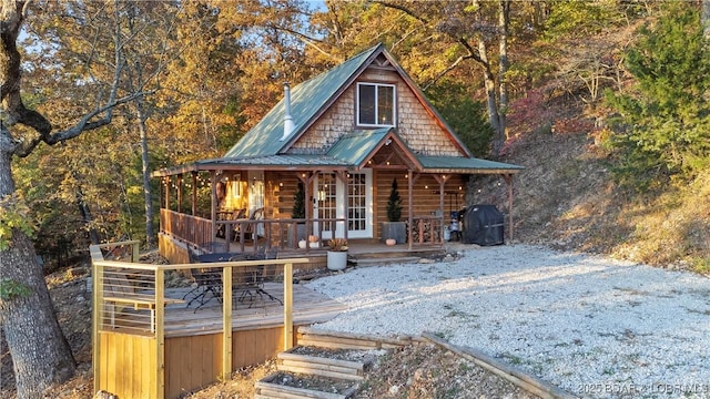 view of front of home featuring a deck and french doors