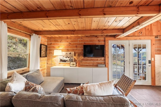 living room featuring wood ceiling, tile patterned floors, beam ceiling, and wood walls