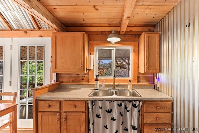 kitchen featuring wood ceiling, beam ceiling, and sink