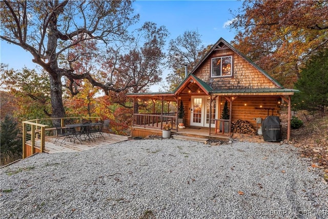 exterior space featuring a wooden deck and french doors