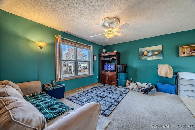 carpeted living room with ceiling fan and a textured ceiling