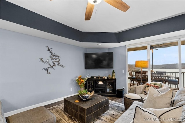 living room with hardwood / wood-style flooring and ceiling fan