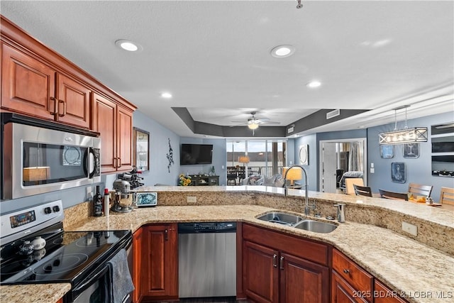 kitchen featuring decorative light fixtures, sink, ceiling fan, stainless steel appliances, and light stone countertops