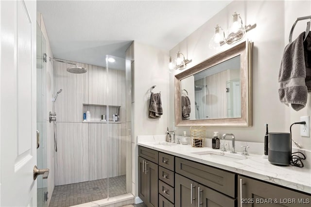 bathroom featuring vanity and a shower with shower door