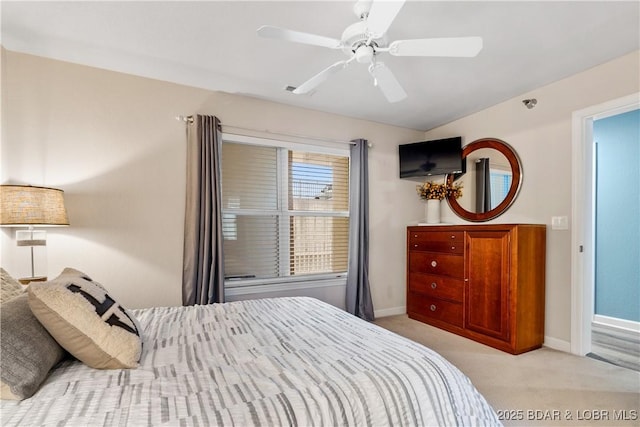 bedroom with ceiling fan and light colored carpet