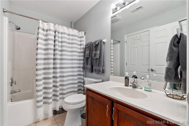 full bathroom with tile patterned floors, toilet, shower / bath combo with shower curtain, and vanity