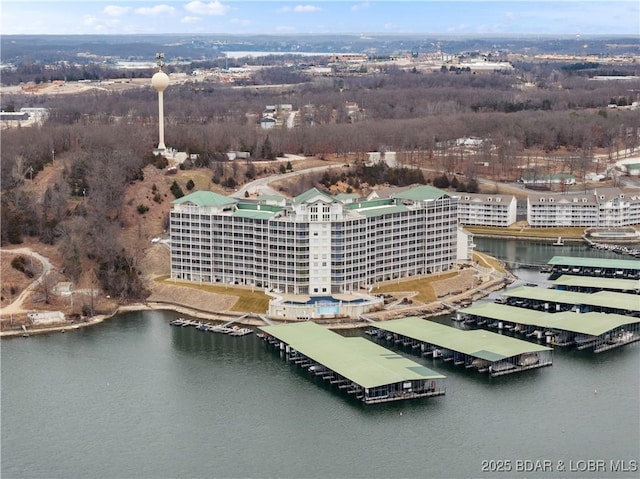 birds eye view of property with a water view