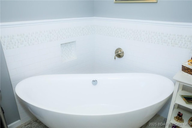 bathroom with a tub