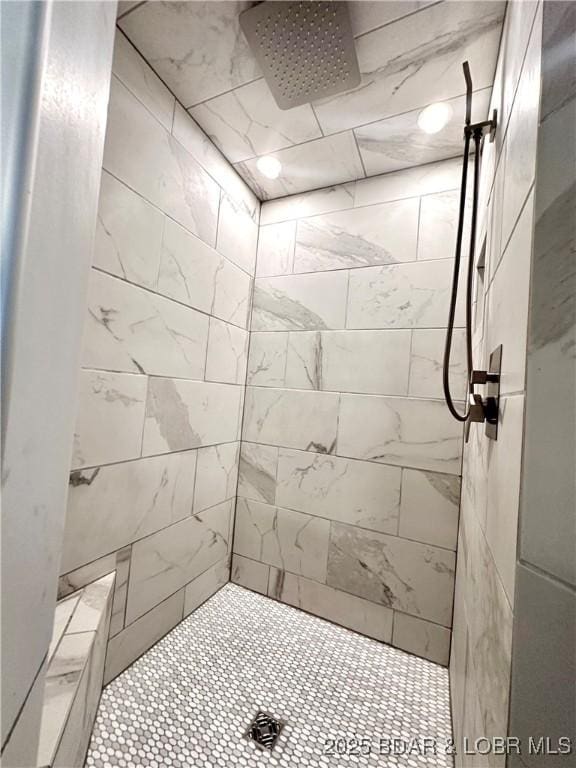 bathroom featuring tiled shower