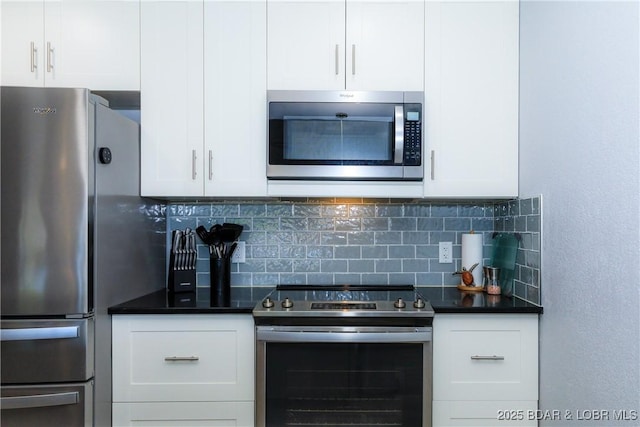 kitchen featuring white cabinetry, appliances with stainless steel finishes, and backsplash