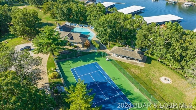 birds eye view of property with a water view