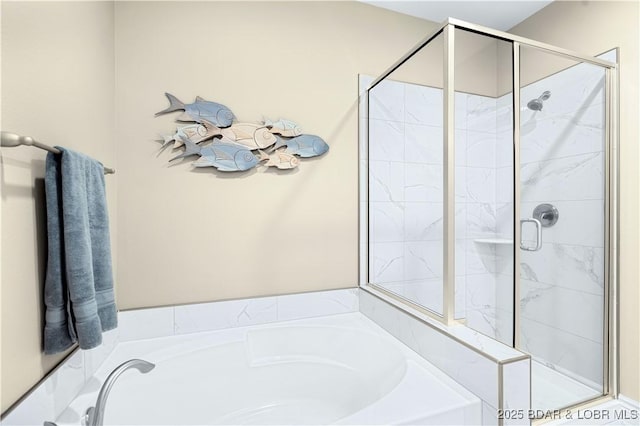 bathroom with shower with separate bathtub