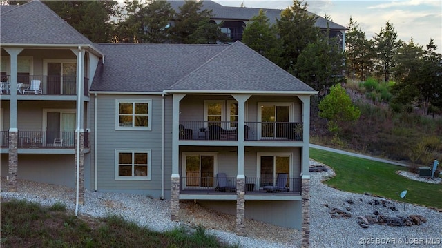 rear view of house featuring a balcony