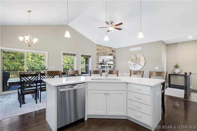 kitchen with sink, white cabinetry, a center island with sink, decorative light fixtures, and stainless steel dishwasher