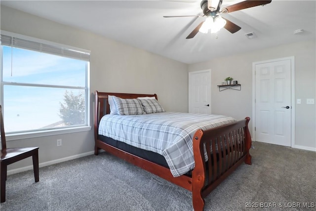 bedroom featuring dark carpet and ceiling fan