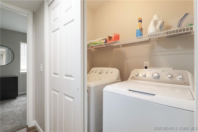 washroom with carpet floors and washing machine and dryer