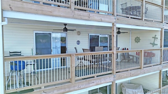 wooden deck featuring ceiling fan