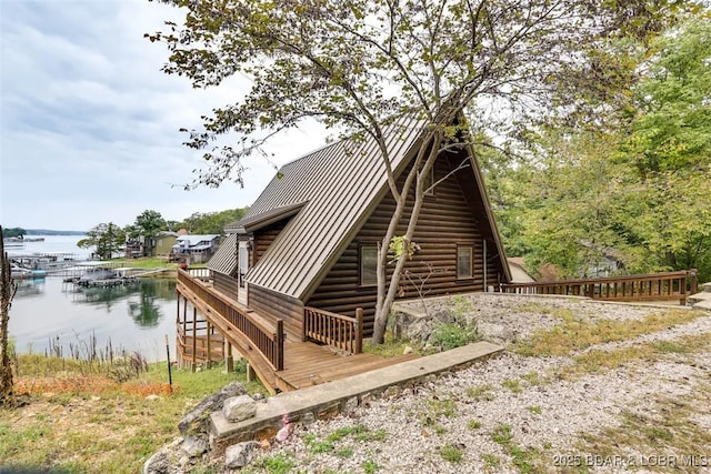 back of property with a water view