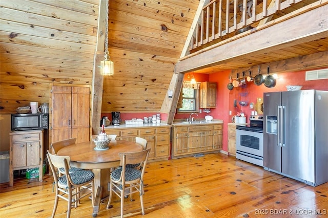 dining area with high vaulted ceiling, sink, wooden ceiling, and light wood-type flooring