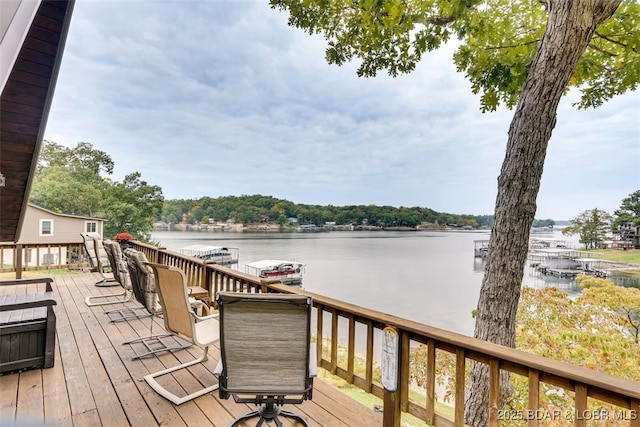 wooden deck with a water view