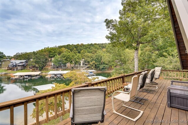 deck featuring a dock and a water view