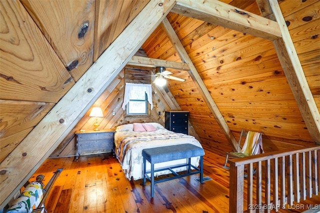 unfurnished bedroom featuring wood-type flooring, vaulted ceiling with beams, and wood ceiling