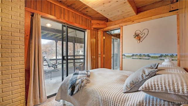 bedroom with wood ceiling, access to outside, wooden walls, and brick wall