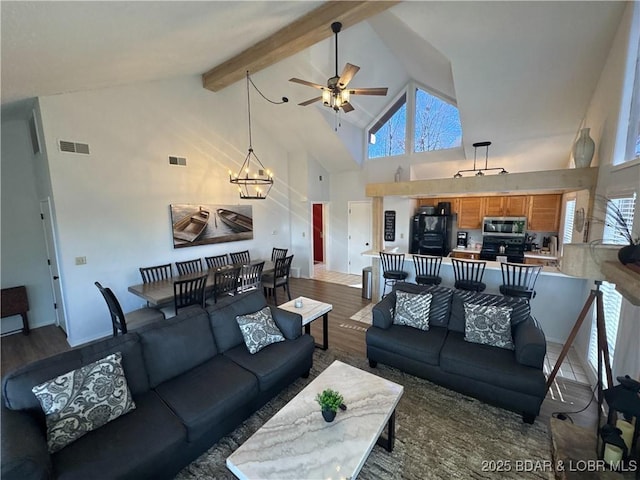 223 Waterscape Dr, Osage Beach, MO 65065 - living area with wood finished floors, high vaulted ceiling, ceiling fan, a chandelier, and beamed ceiling