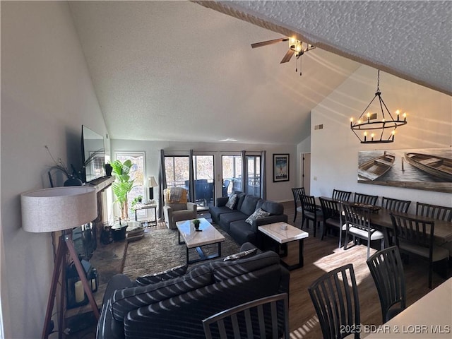 223 Waterscape Dr, Osage Beach, MO 65065 - living room with a chandelier, a textured ceiling, wood finished floors, a ceiling fan, and high vaulted ceiling