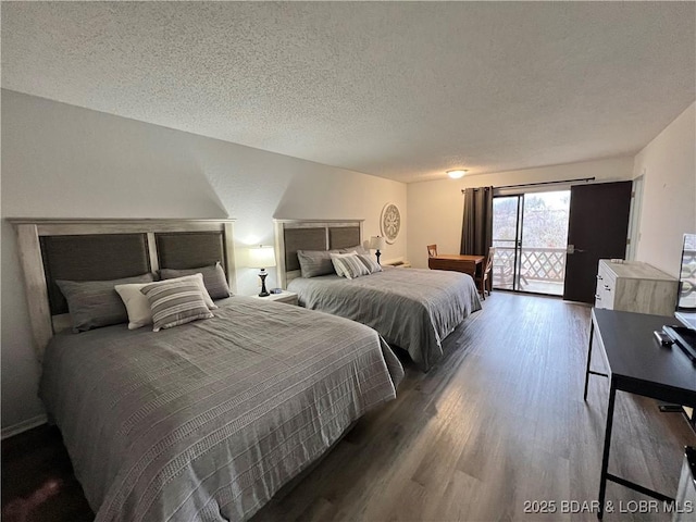 223 Waterscape Dr, Osage Beach, MO 65065 - bedroom with wood finished floors, a textured ceiling, and access to outside