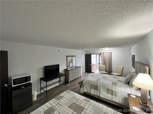 223 Waterscape Dr, Osage Beach, MO 65065 - bedroom featuring refrigerator, a textured ceiling, and wood finished floors