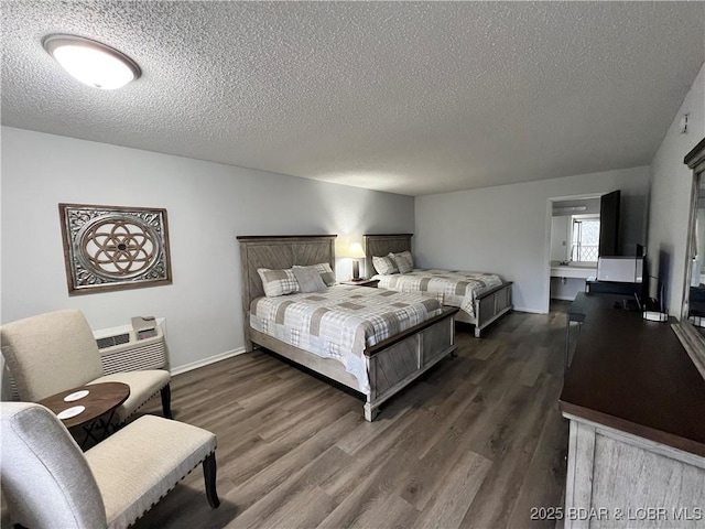 223 Waterscape Dr, Osage Beach, MO 65065 - bedroom with a textured ceiling, dark wood-type flooring, and baseboards
